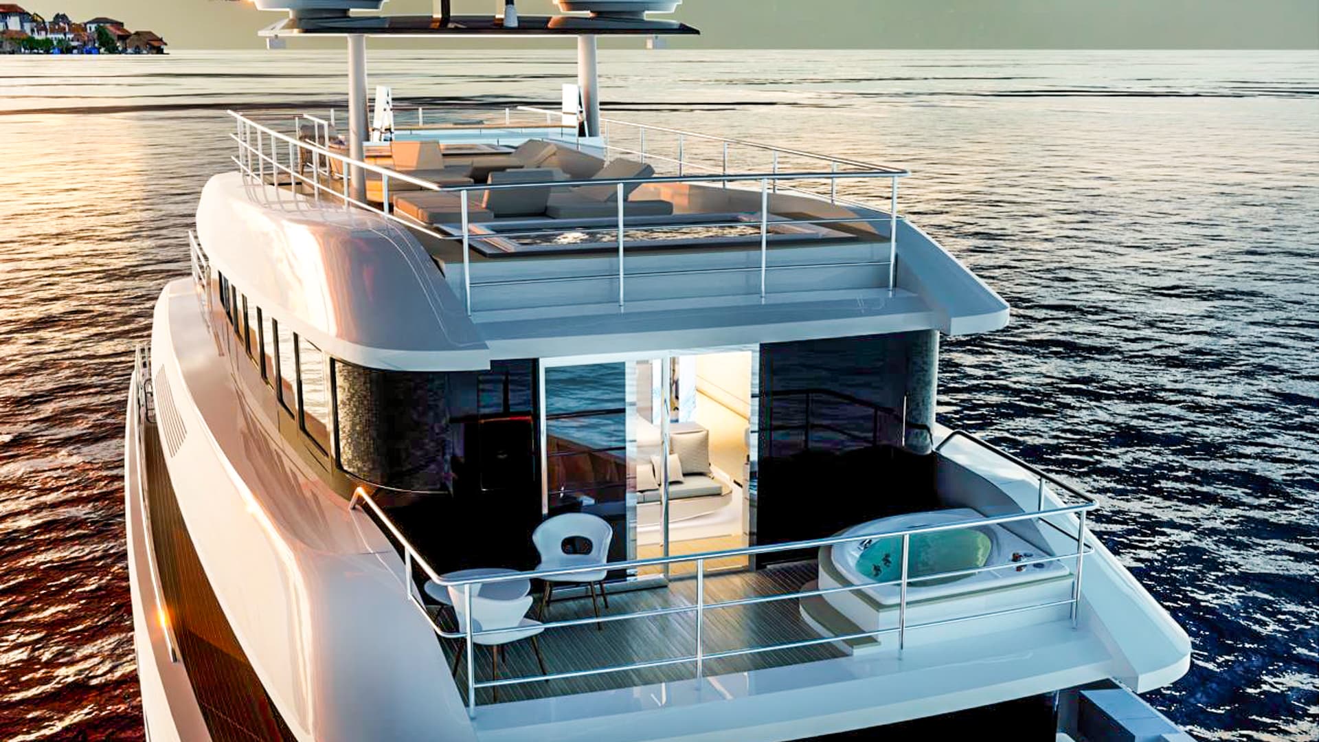 Stern view of a luxury yacht deck with jacuzzi, seating, and ocean view at sunset