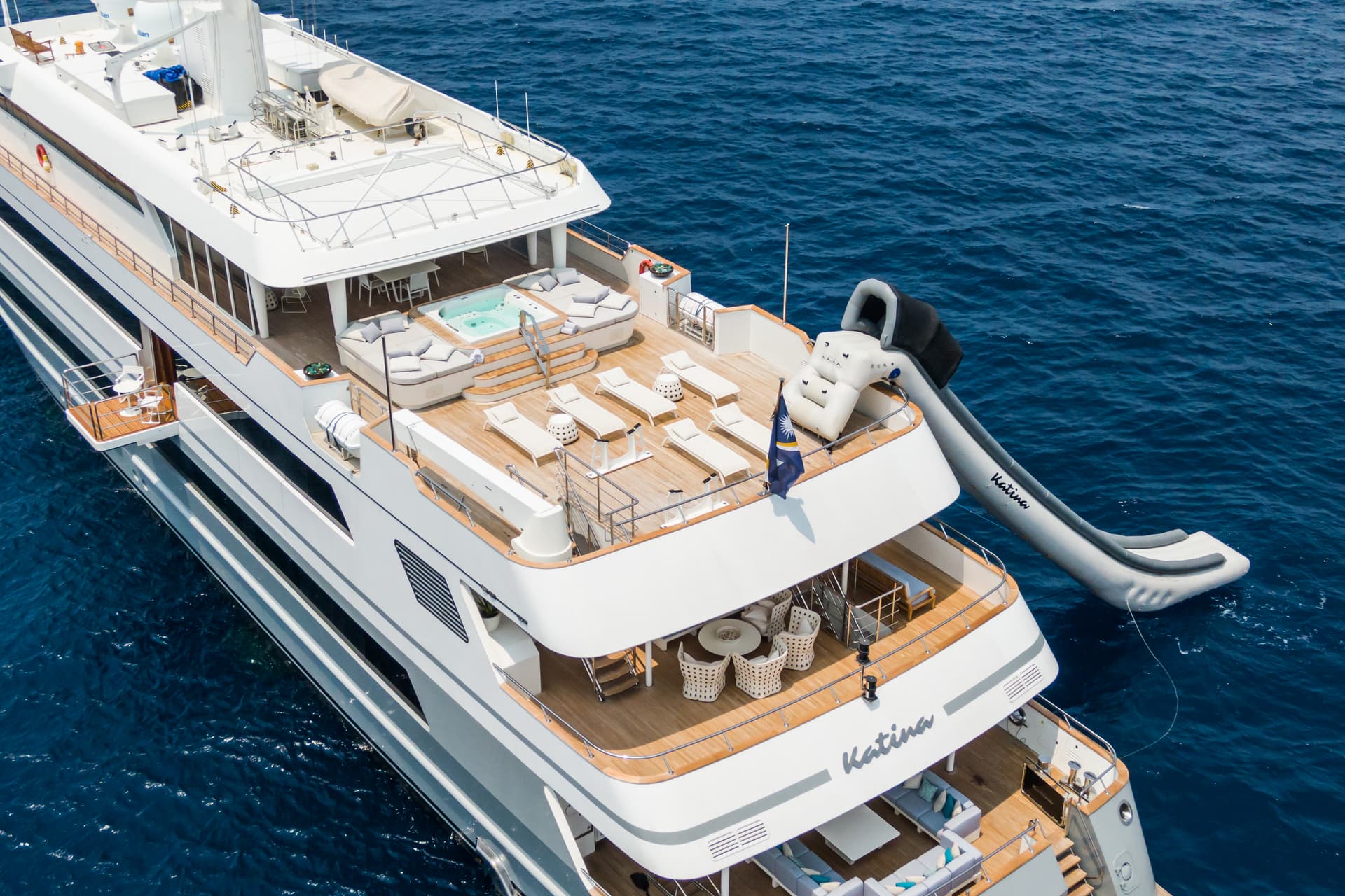 Luxury yacht "Katina" with jacuzzi and inflatable slide on deep blue sea water