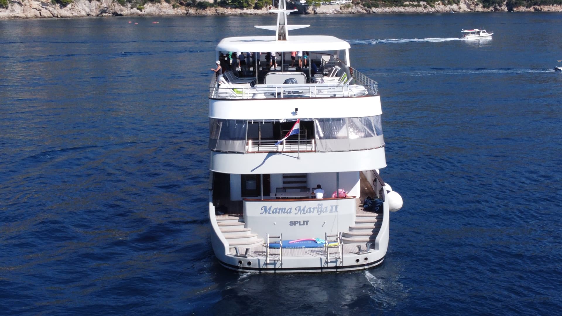 Yacht named Mama Marija II on blue coastal water near Split