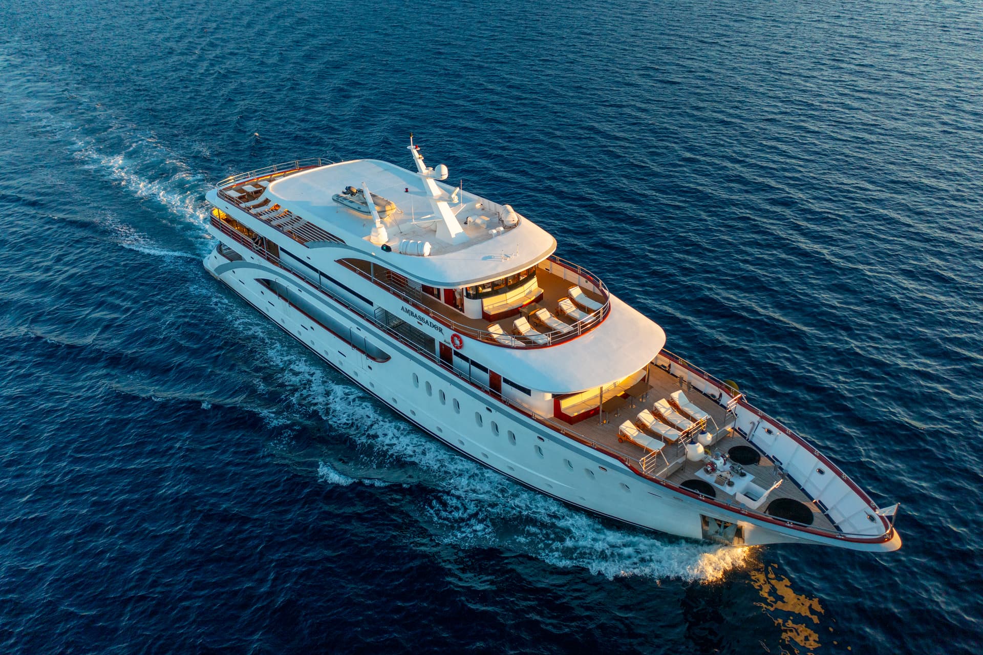 Ambassador yacht cruising on open blue sea water