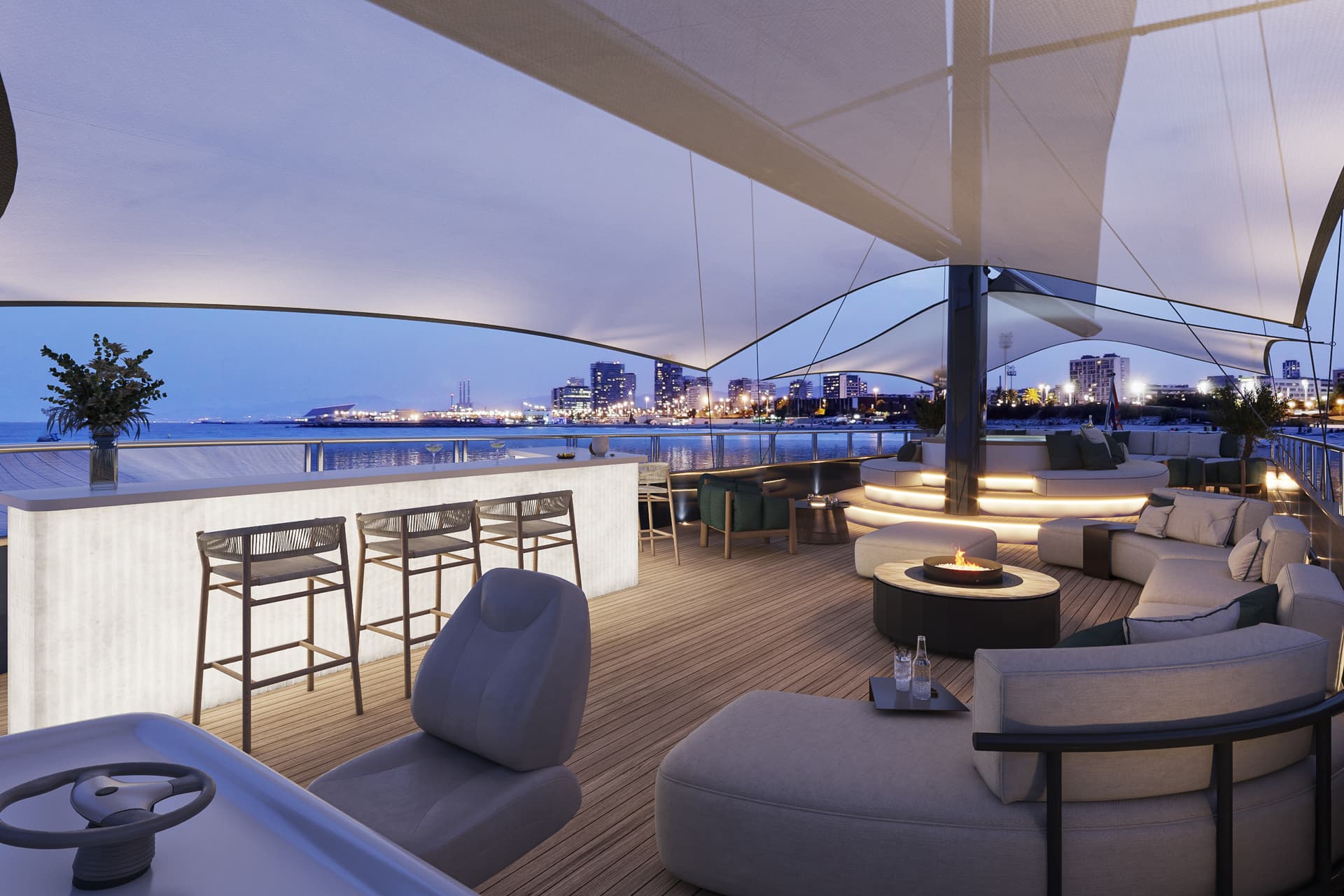 Luxury yacht deck lounge and bar with seating, fire pit, and canopy overlooking coastal city skyline at dusk