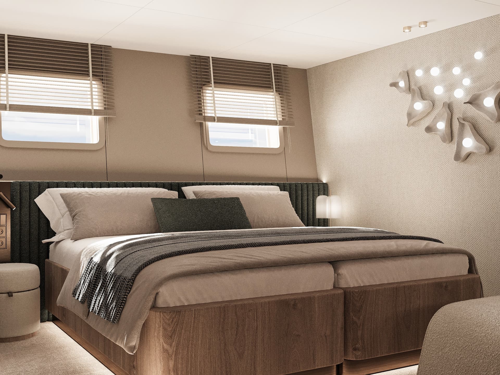 Modern guest cabin interior with large bed and porthole windows