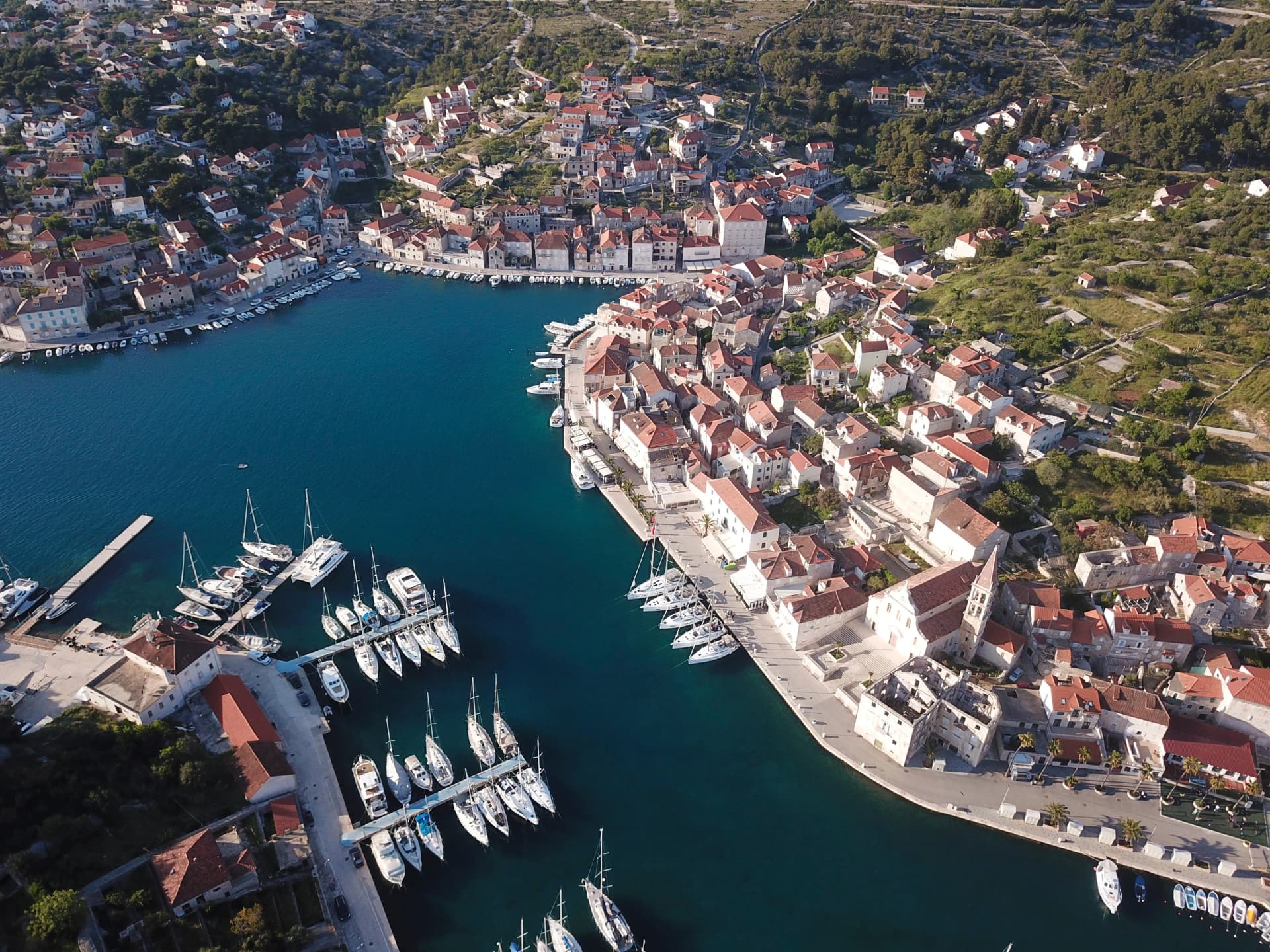 Milna village in Croatia on the island Brac and sailboats, areal view