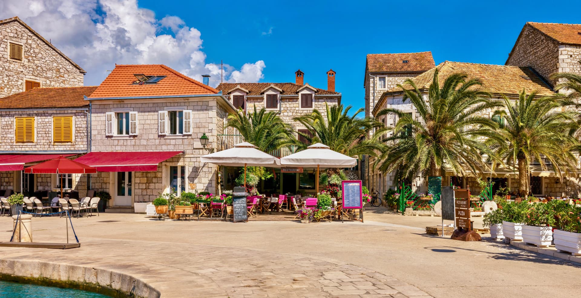 A colorful panorama of a Mediterranean resort town in summer. Stari Grad, Hvar Island, Croatia.