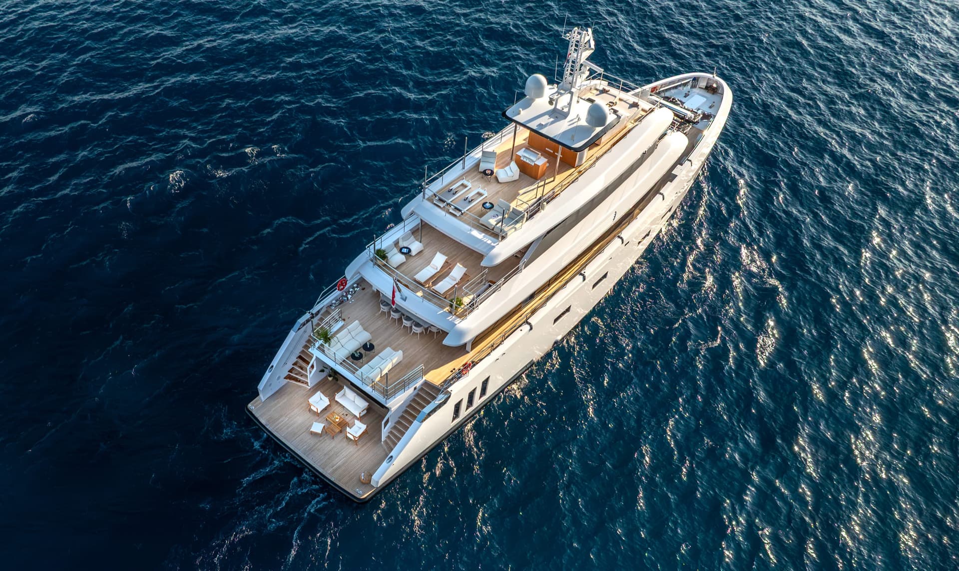Luxury yacht cruising on deep blue sea water
