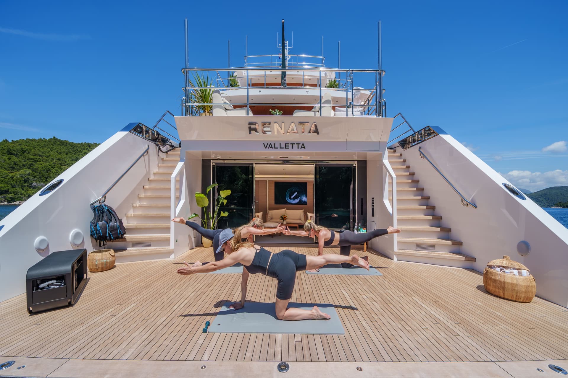 Women doing yoga on the deck of yacht Renata in Valletta